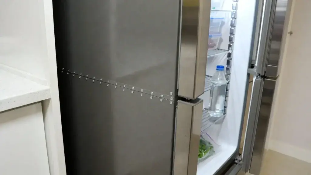 a modern refrigerator with a newly installed door gasket