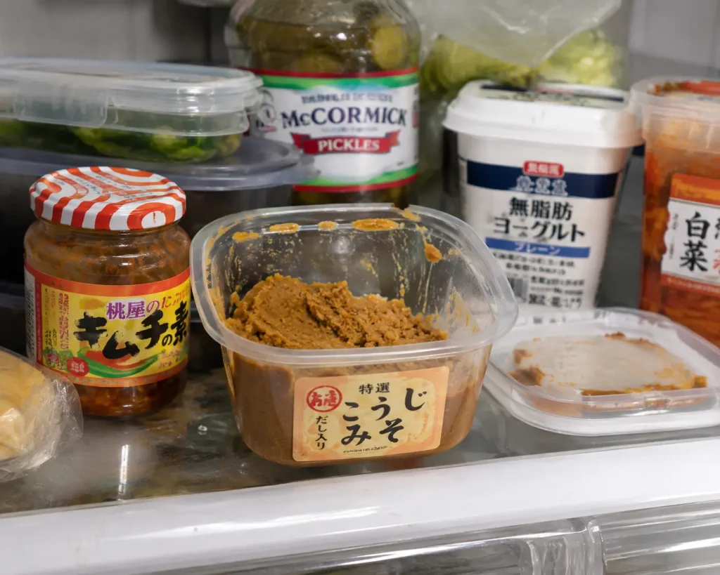 a refrigerator shelf showing improper miso storage